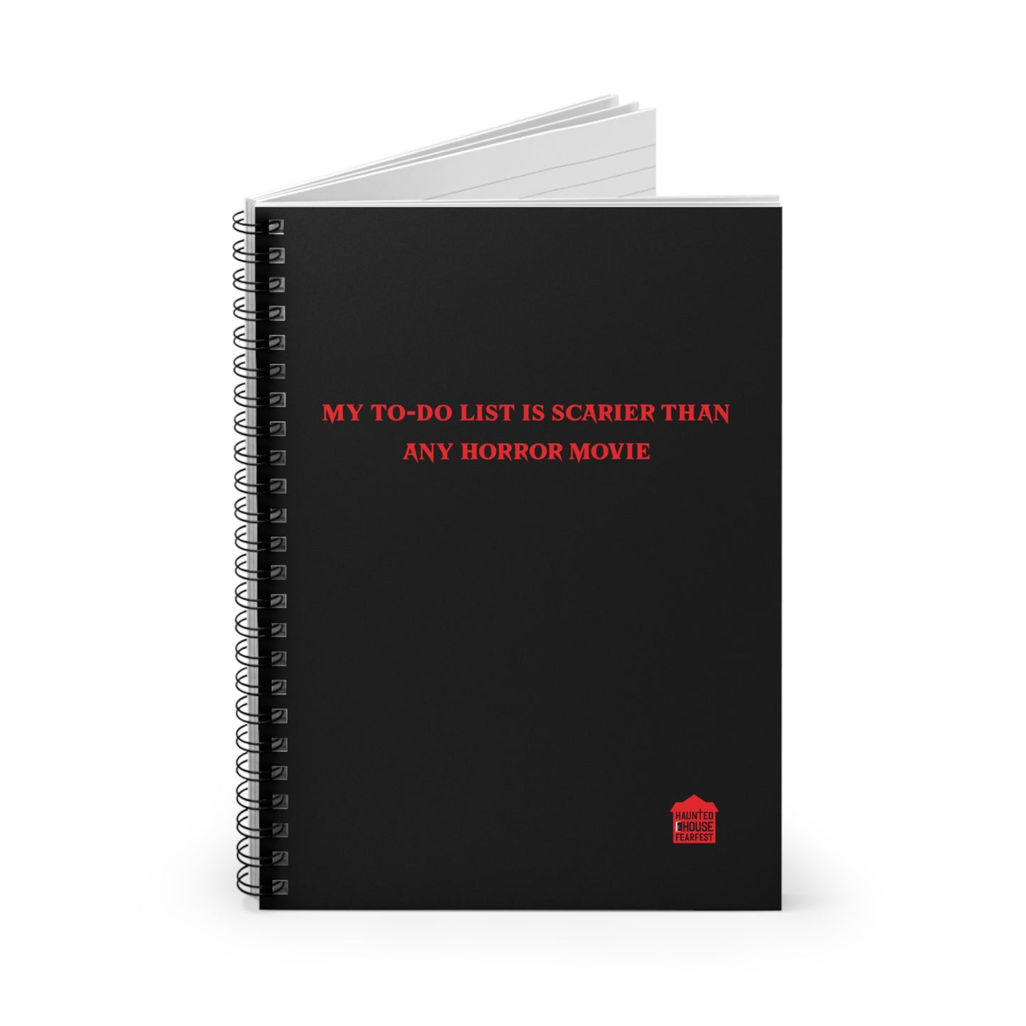 Black notebook with red text and a small logo on a white background