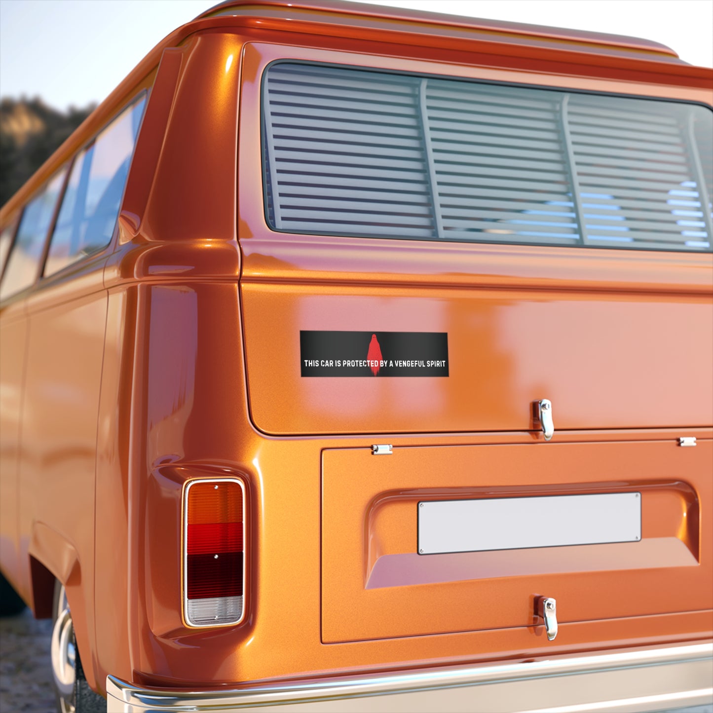 Orange vintage van with a visible sticker on the back